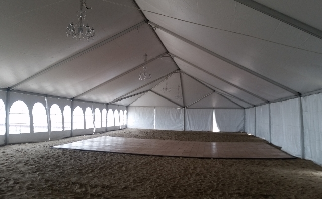 inside a 40 ft. x 100 ft. frame tent on a Lake Erie beach