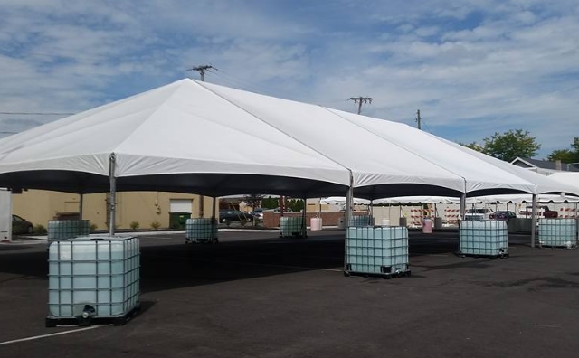 40 ft. x 80 ft. frame tent anchored with water totes