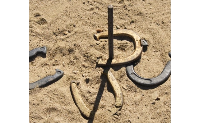 Horseshoes game in sand